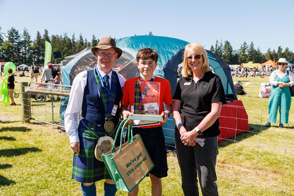 Chieftain Colin Forsyth with FMG Kilted Mile Winner Mac Smith and Donna Murray (FMG)